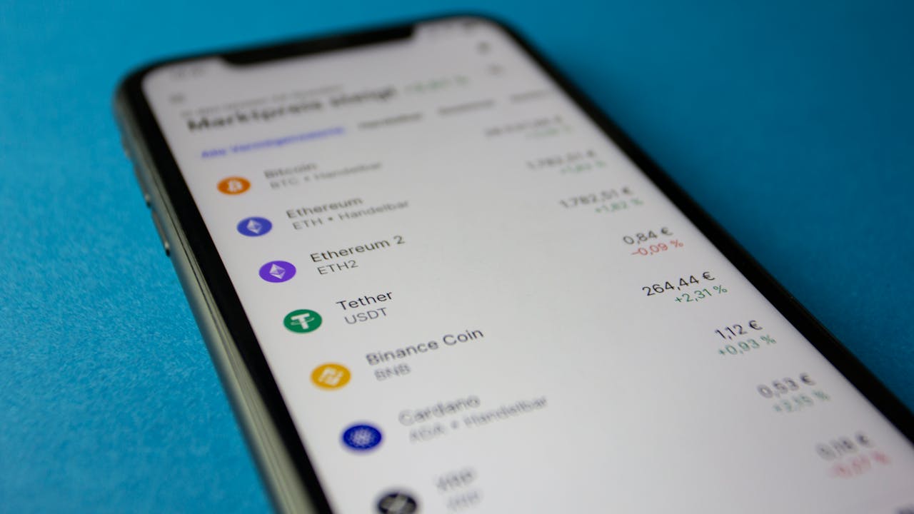 Crafting Captivating Headlines: Your awesome post title goes here Close-up photo of a smartphone displaying cryptocurrency market data with price listings.